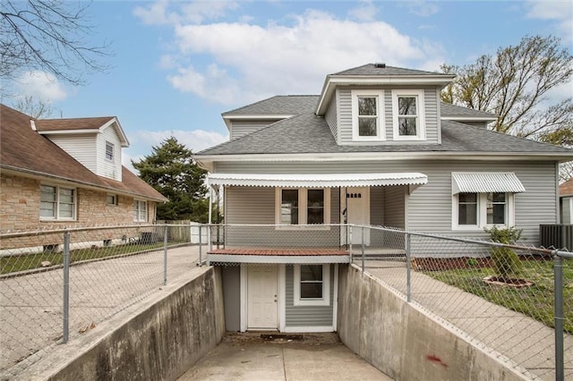 628 S Huttig Ave, Independence, MO 64053 - bungalow with a fenced backyard, roof with shingles, and central air condition unit