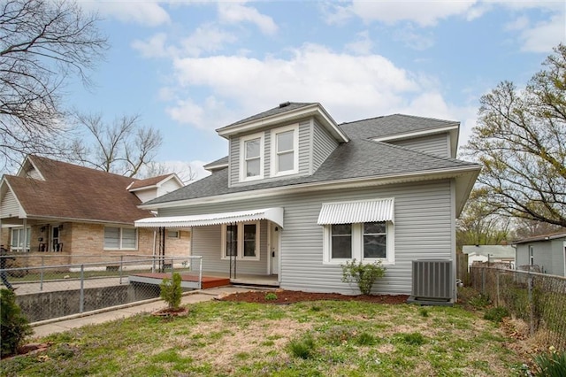 628 S Huttig Ave, Independence, MO 64053 - rear view of property with central air condition unit and a shingled roof
