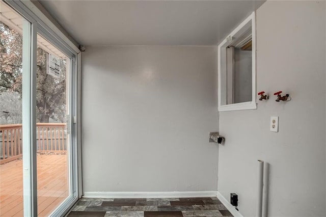 628 S Huttig Ave, Independence, MO 64053 - clothes washing area with baseboards and dark wood-style floors