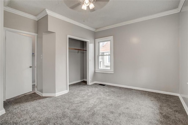 628 S Huttig Ave, Independence, MO 64053 - unfurnished bedroom with carpet flooring, crown molding, baseboards, a closet, and a ceiling fan