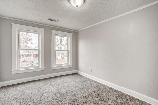 628 S Huttig Ave, Independence, MO 64053 - carpeted empty room with a textured ceiling, baseboards, and crown molding