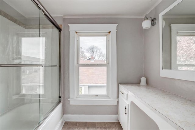 628 S Huttig Ave, Independence, MO 64053 - full bath featuring combined bath / shower with glass door, crown molding, healthy amount of natural light, vanity, and baseboards