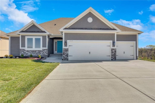 10201 N Winchester Ave, Kansas City, MO 64156 - view of front of house with a garage, a front yard, concrete driveway, and stone siding