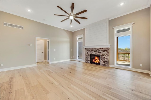 10201 N Winchester Ave, Kansas City, MO 64156 - unfurnished living room with a ceiling fan, ornamental molding, light wood-type flooring, a fireplace, and baseboards