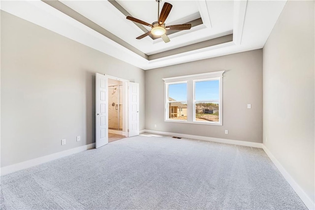 10201 N Winchester Ave, Kansas City, MO 64156 - unfurnished bedroom featuring light colored carpet, a raised ceiling, and baseboards