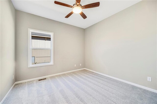 10201 N Winchester Ave, Kansas City, MO 64156 - carpeted empty room featuring baseboards and a ceiling fan
