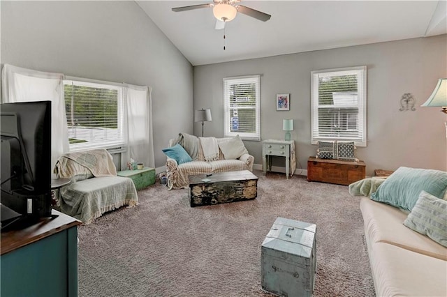 carpeted living area with a ceiling fan and lofted ceiling