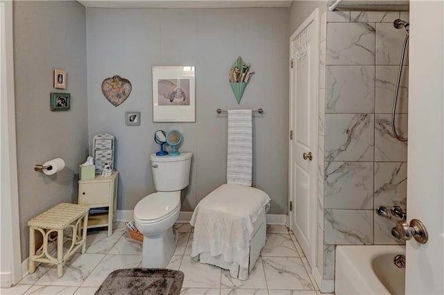 bathroom with marble finish flooring, toilet, and shower / bathtub combination