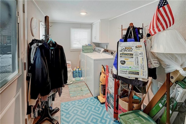 laundry area featuring washer and dryer and cabinet space