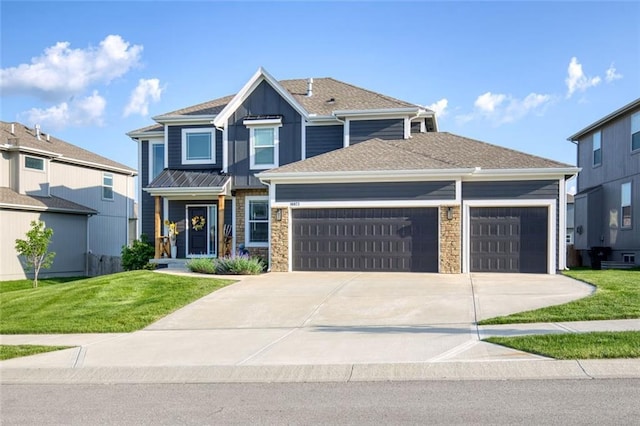18873 W 168th Ter, Olathe, KS 66062 - view of front facade with an attached garage, driveway, a front lawn, and stone siding