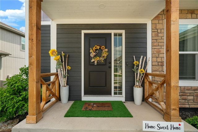 18873 W 168th Ter, Olathe, KS 66062 - doorway to property with stone siding and covered porch