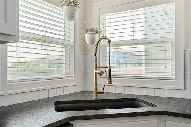 18873 W 168th Ter, Olathe, KS 66062 - kitchen view of a sink, tasteful backsplash, and white cabinets