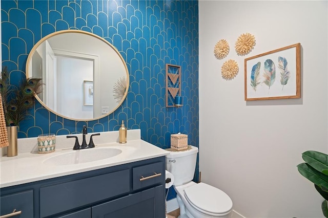 18873 W 168th Ter, Olathe, KS 66062 - bathroom featuring vanity, wallpapered walls, and toilet