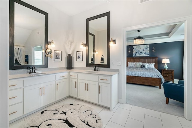 18873 W 168th Ter, Olathe, KS 66062 - ensuite bathroom with tile patterned floors, double vanity, and vaulted ceiling