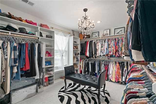 18873 W 168th Ter, Olathe, KS 66062 - walk in closet featuring carpet floors and a chandelier