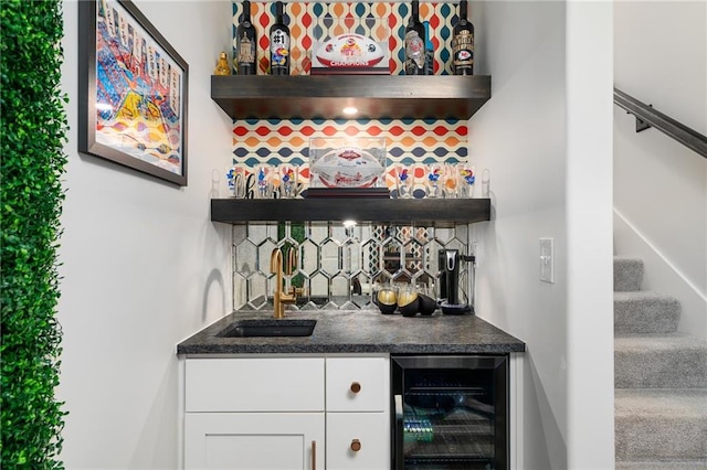 18873 W 168th Ter, Olathe, KS 66062 - indoor wet bar featuring wine cooler, stairs, and backsplash