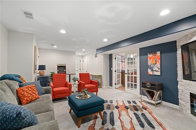 18873 W 168th Ter, Olathe, KS 66062 - carpeted living area with recessed lighting, french doors, a fireplace, and baseboards
