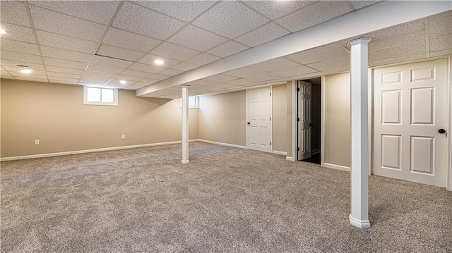 basement with carpet, baseboards, recessed lighting, and a drop ceiling