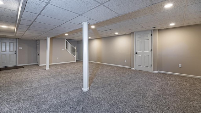 finished below grade area featuring carpet floors, recessed lighting, stairs, baseboards, and a drop ceiling