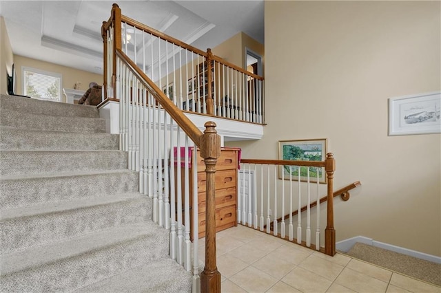 staircase with tile patterned flooring and baseboards