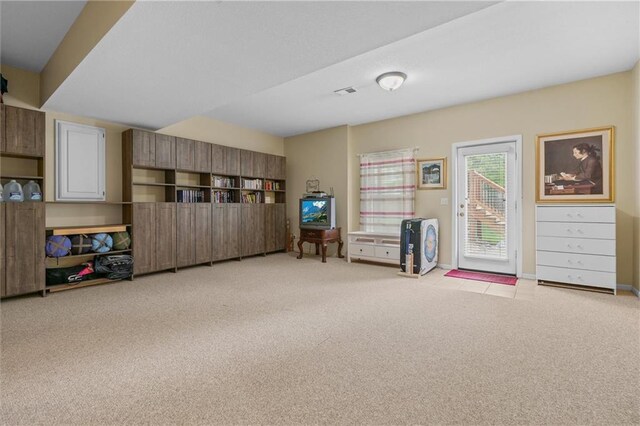 game room with light colored carpet