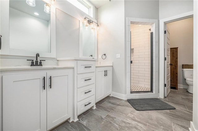 1309 NW 107th Ter, Kansas City, MO 64155 - bathroom featuring a stall shower, toilet, vanity, and baseboards