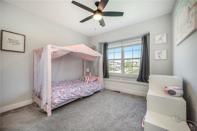1309 NW 107th Ter, Kansas City, MO 64155 - bedroom featuring carpet floors, baseboards, and a ceiling fan