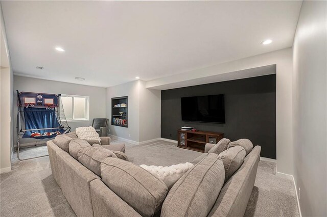 1309 NW 107th Ter, Kansas City, MO 64155 - living room featuring light colored carpet, baseboards, and recessed lighting