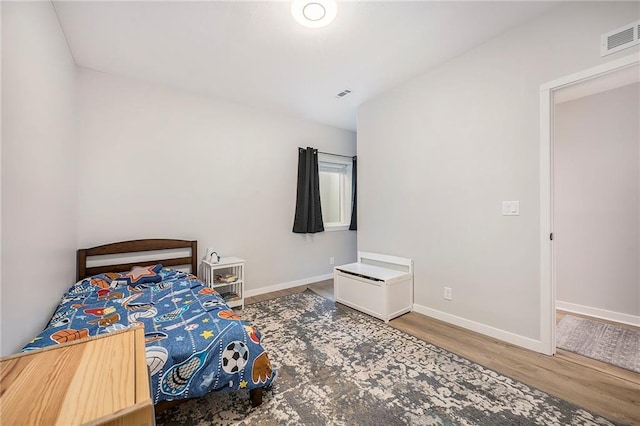 1309 NW 107th Ter, Kansas City, MO 64155 - bedroom featuring wood finished floors and baseboards