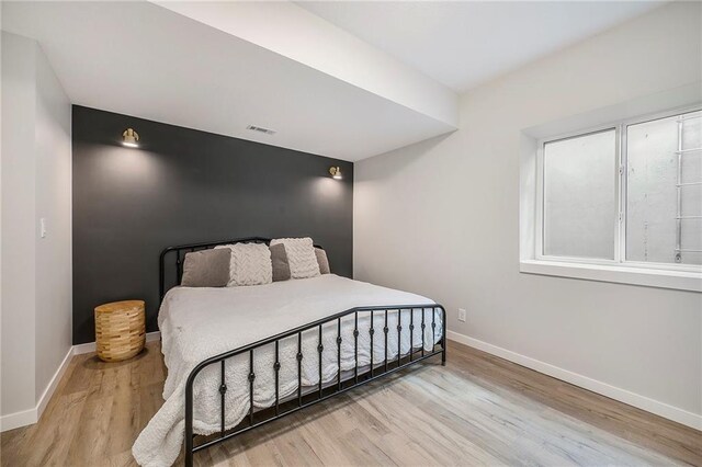 1309 NW 107th Ter, Kansas City, MO 64155 - bedroom with wood finished floors and baseboards