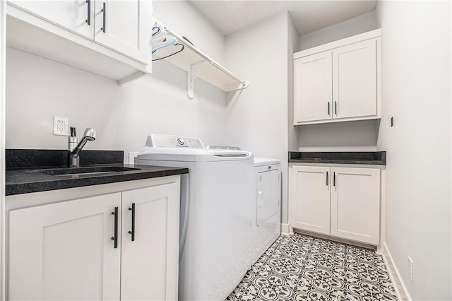 1309 NW 107th Ter, Kansas City, MO 64155 - washroom with separate washer and dryer, cabinet space, and baseboards