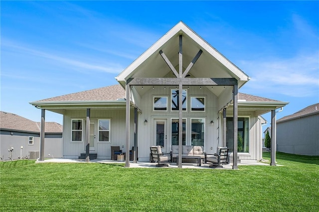 1309 NW 107th Ter, Kansas City, MO 64155 - back of house featuring a patio area, a yard, outdoor lounge area, and a shingled roof
