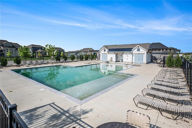 1309 NW 107th Ter, Kansas City, MO 64155 - community pool featuring fence, a residential view, and a patio area