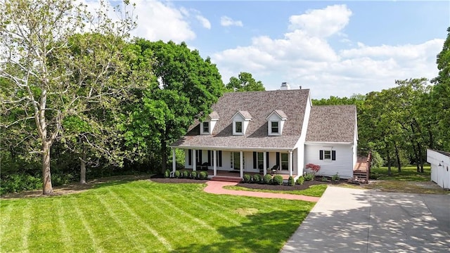 19325 W 87th St, Lenexa, KS 66220 - new england style home with a porch, a front lawn, and a chimney