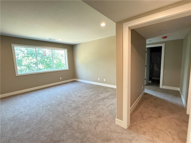202 E Maple St, Lone Jack, MO 64070 - spare room featuring light carpet and recessed lighting
