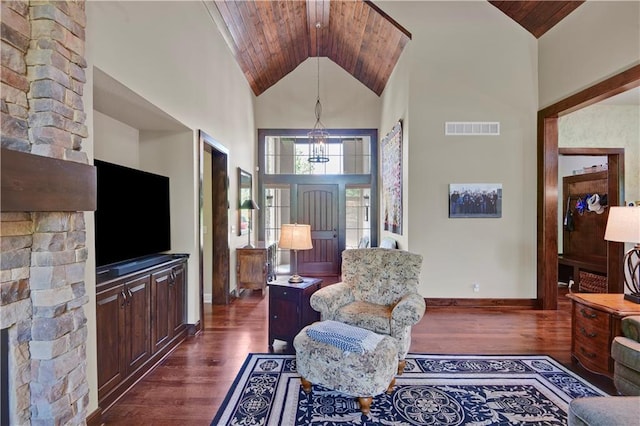 entrance foyer featuring dark wood-style flooring, high vaulted ceiling, baseboards, a chandelier, and wood ceiling