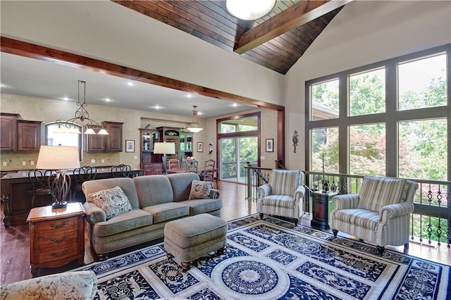 living room with wood finished floors, beamed ceiling, recessed lighting, high vaulted ceiling, and wood ceiling