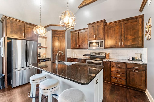 31560 W 85th St, De Soto, KS 66018 - kitchen with appliances with stainless steel finishes, a sink, a chandelier, lofted ceiling, and dark wood-style flooring