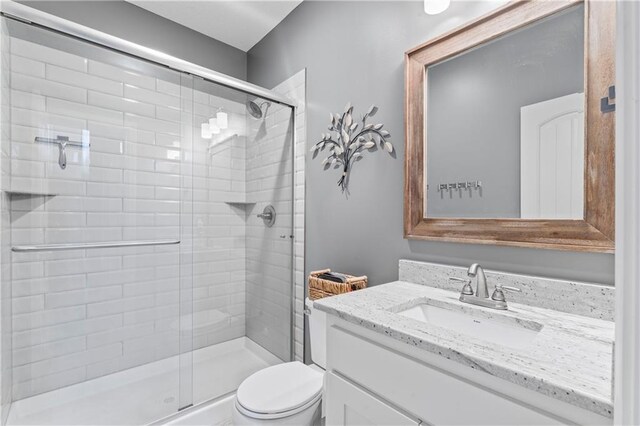 31560 W 85th St, De Soto, KS 66018 - bathroom featuring a stall shower, toilet, and vanity