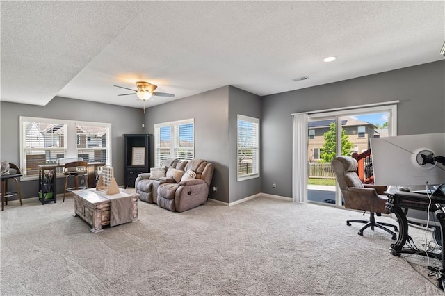 31560 W 85th St, De Soto, KS 66018 - living area with a textured ceiling, carpet floors, a ceiling fan, baseboards, and an office area