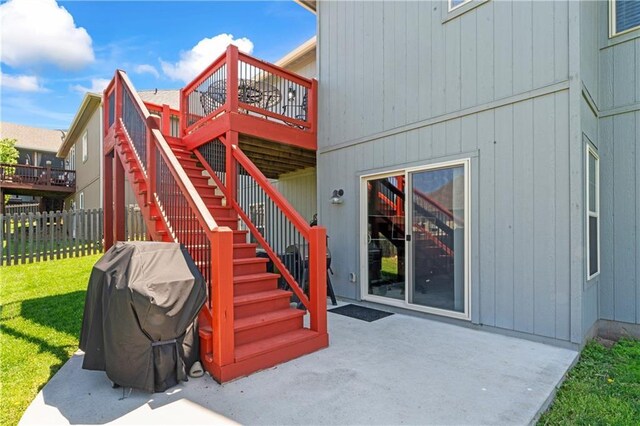 31560 W 85th St, De Soto, KS 66018 - property entrance featuring a patio and a wooden deck