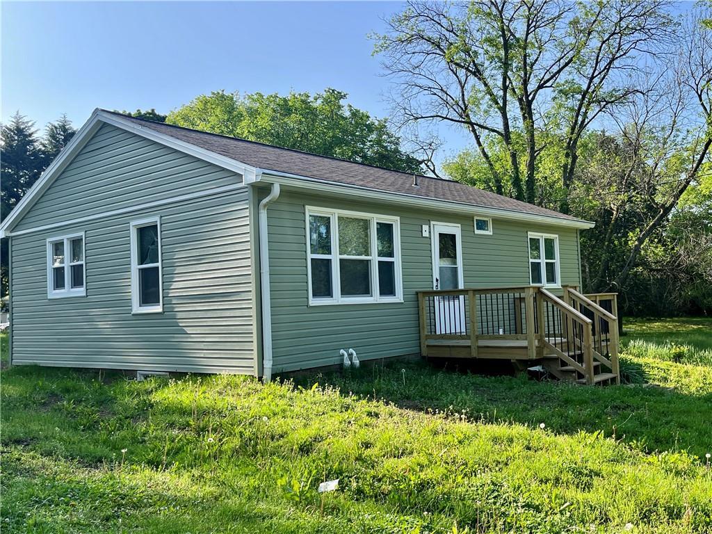 406 S Monroe Ave, Knob Noster, MO 65336 - rear view of house with a wooden deck