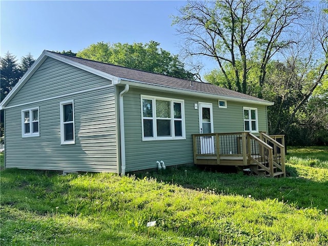 rear view of house with a wooden deck