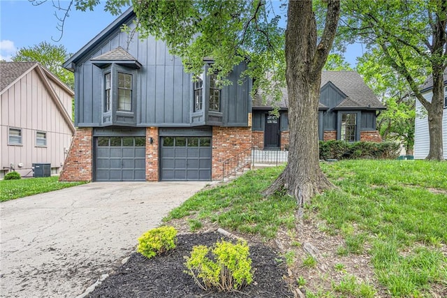 1912 E 153rd Ter, Olathe, KS 66062 - view of front of property featuring brick siding, central air condition unit, driveway, and a garage