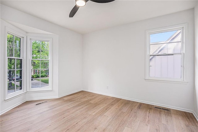 1912 E 153rd Ter, Olathe, KS 66062 - spare room with light wood-style floors, baseboards, and ceiling fan