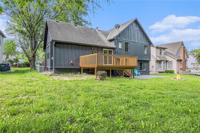 1912 E 153rd Ter, Olathe, KS 66062 - rear view of property featuring a deck, roof with shingles, board and batten siding, and a yard