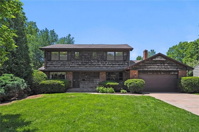 5811 W 85th Ter, Overland Park, KS 66207 - view of front of house with a garage, a front yard, driveway, and brick siding