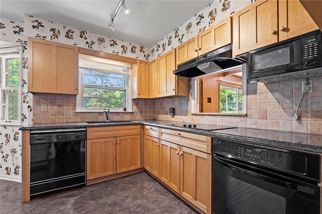 5811 W 85th Ter, Overland Park, KS 66207 - kitchen with black appliances, a sink, under cabinet range hood, healthy amount of natural light, and wallpapered walls