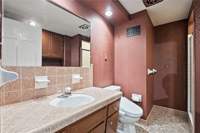 5811 W 85th Ter, Overland Park, KS 66207 - bathroom featuring toilet, an enclosed shower, baseboards, tasteful backsplash, and vanity