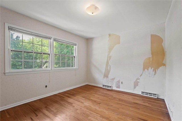 5811 W 85th Ter, Overland Park, KS 66207 - spare room with wood finished floors and baseboards
